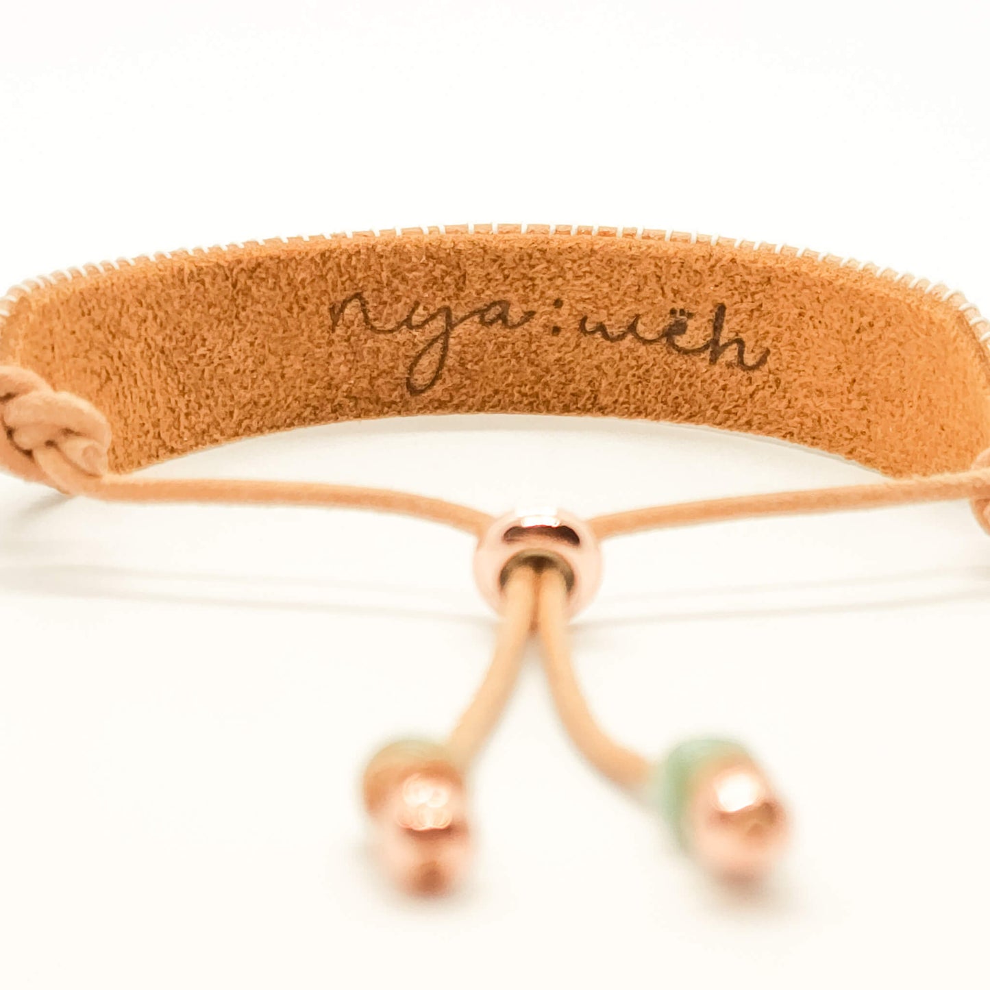 bracelet backview showing nyaweh leather logo stamp